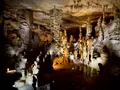 Massive illuminated stalagmites and cave formations inside Cathedral Caverns, Alabama
