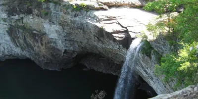 Scenic view at DeSoto State Park, Alabama, featuring lush forest and a cascading waterfall on Lookout Mountain