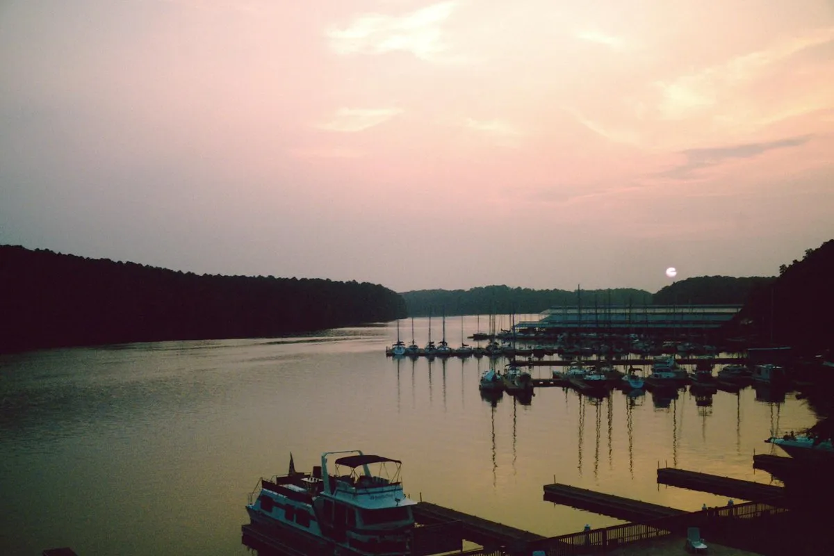 Calm waters of Wheeler Lake at Joe Wheeler State Park, Alabama, with tree-lined shores reflecting in the lake