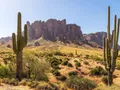 Scenic view of rugged Superstition Mountains rising above Sonoran Desert cactus at Lost Dutchman State Park, Arizona
