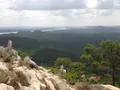 Scenic view of the cone-shaped summit of Pinnacle Mountain rising above green forest in Arkansas