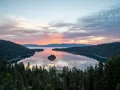 Aerial view of Emerald Bay at Lake Tahoe, California, with glacier-carved turquoise water and forested Sierra Nevada slopes