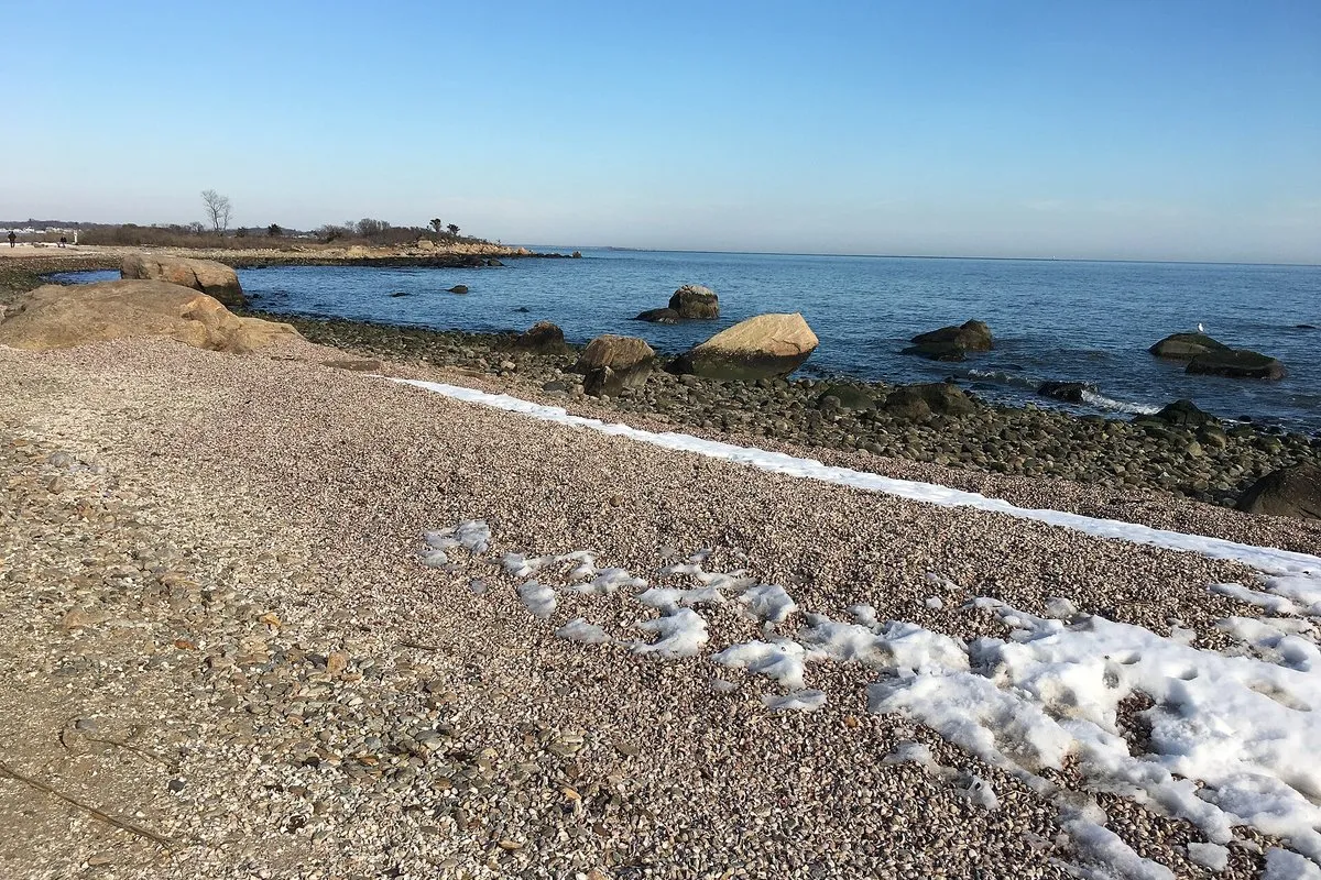 Scenic view of the sandy beach and calm waters at Hammonasset Beach State Park, Connecticut