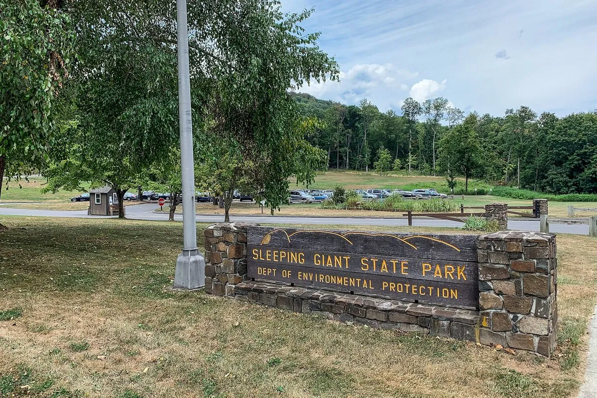 Scenic wooded ridge view at Sleeping Giant State Park, Connecticut, showing the rolling traprock hills resembling a reclining figure