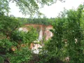 Colorful layered canyon walls with vivid pink, red, and white soil striations at Providence Canyon, Georgia
