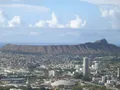 Scenic view at Diamond Head, Hawaii, showing the volcanic crater rim and sweeping Pacific Ocean coastline beyond Honolulu