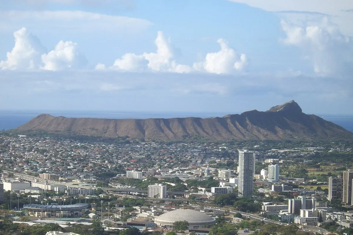 Scenic view at Diamond Head, Hawaii, showing the volcanic crater rim and sweeping Pacific Ocean coastline beyond Honolulu