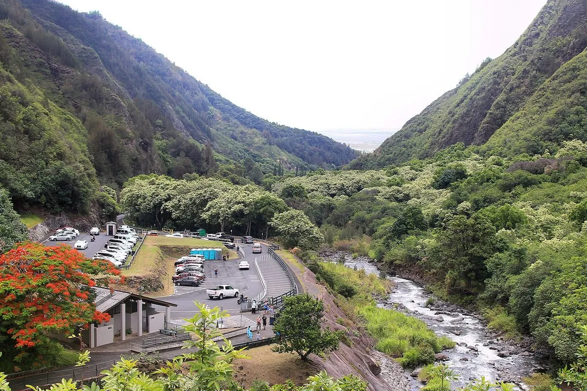 Scenic view of the Iao Needle rising above the lush green rainforest valley at Iao Valley State Monument, Maui, Hawaii