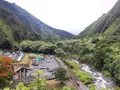 Scenic view of the Iao Needle rising above the lush green rainforest valley at Iao Valley State Monument, Maui, Hawaii