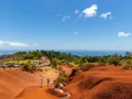 Aerial view of Waimea Canyon's dramatic red and green ridges stretching into the distance on Kauai, Hawaii