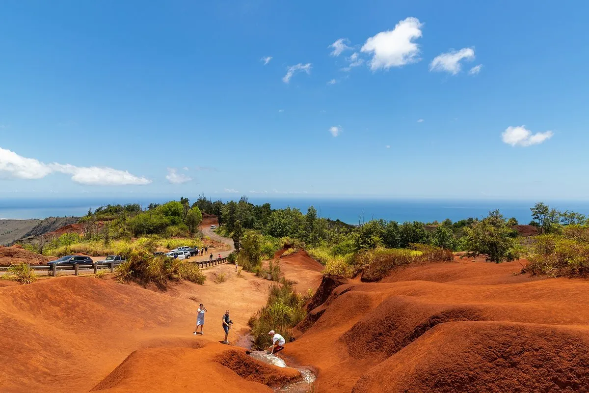 Aerial view of Waimea Canyon's dramatic red and green ridges stretching into the distance on Kauai, Hawaii