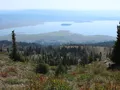 Scenic view at Lake Cascade, Idaho, with the reservoir reflecting blue skies and surrounding forested hills