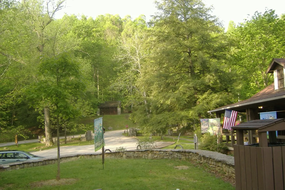 Rocky cave entrance and lush forest canopy at Carter Caves, Kentucky