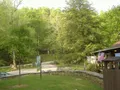 Rocky cave entrance and lush forest canopy at Carter Caves, Kentucky