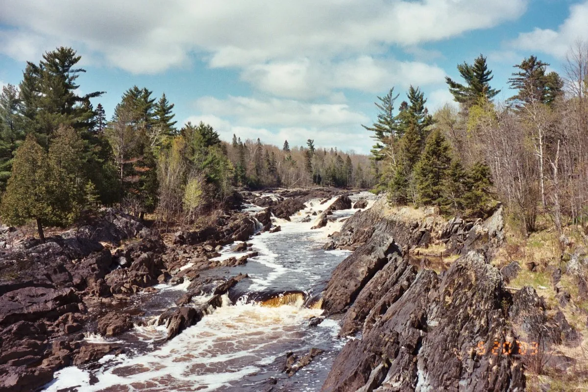 Swinging bridge over the rocky St. Louis River gorge at Jay Cooke State Park, Minnesota