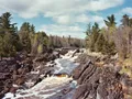 Swinging bridge over the rocky St. Louis River gorge at Jay Cooke State Park, Minnesota