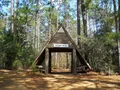 Scenic view of Geiger Lake and forested shoreline at Paul B. Johnson State Park, Mississippi