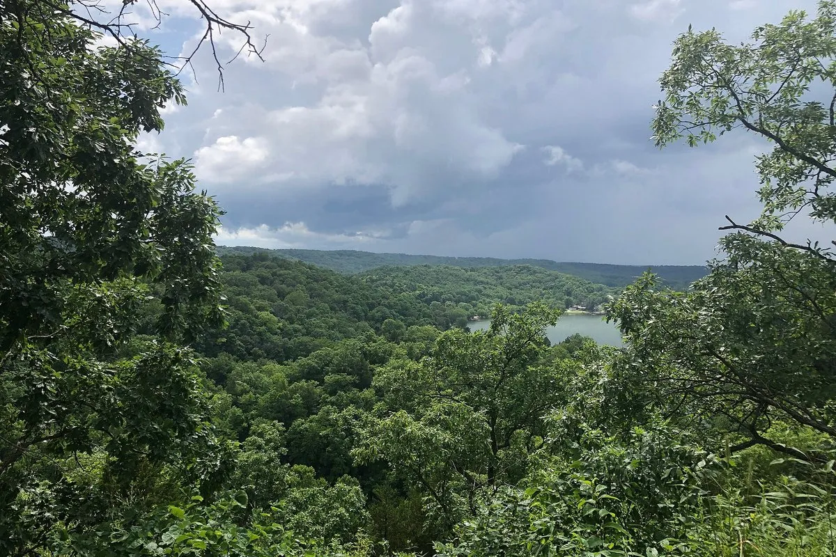 Scenic view of Ha Ha Tonka State Park, Missouri, with stone castle ruins overlooking a wooded karst landscape and Lake of the Ozarks