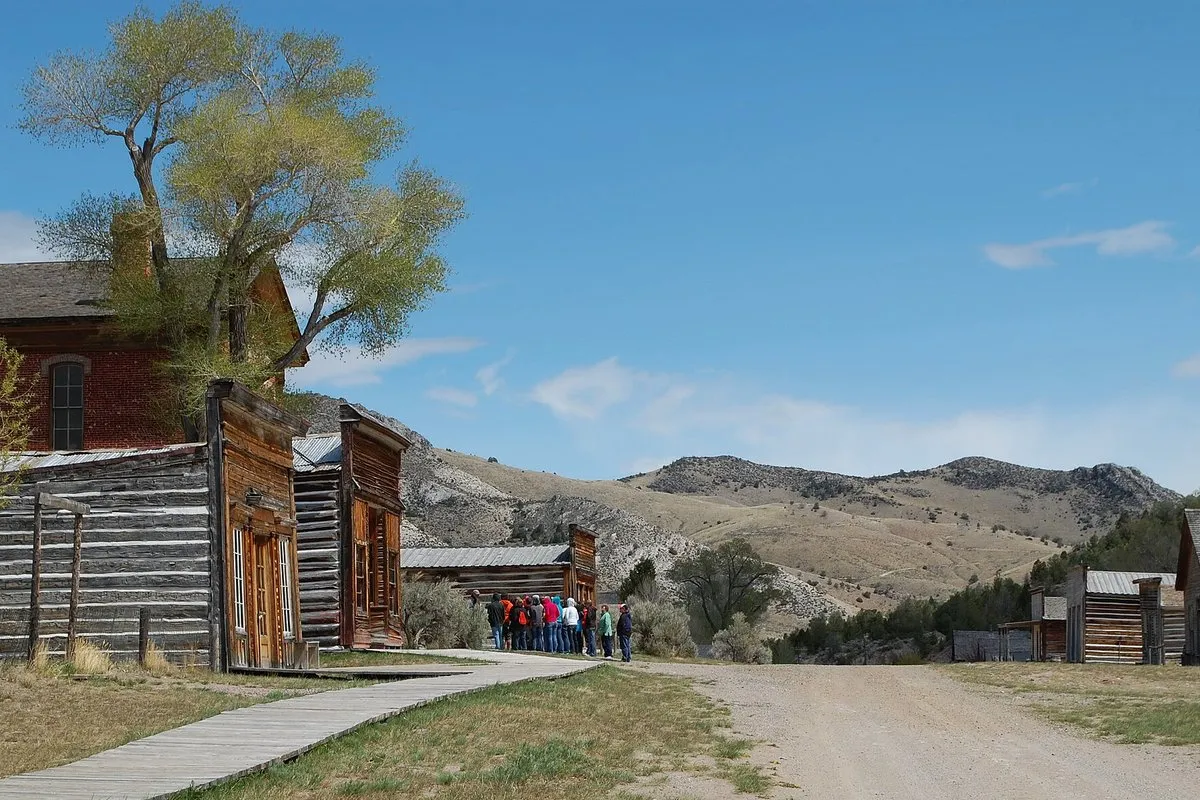 Historic wooden buildings of the Bannack ghost town set against the Montana hills and open sky