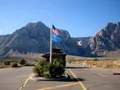 Scenic view of Spring Mountain Ranch State Park, Nevada, with red sandstone cliffs and lush green meadow