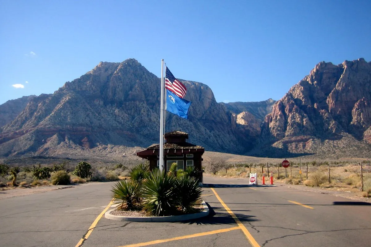 Scenic view of Spring Mountain Ranch State Park, Nevada, with red sandstone cliffs and lush green meadow