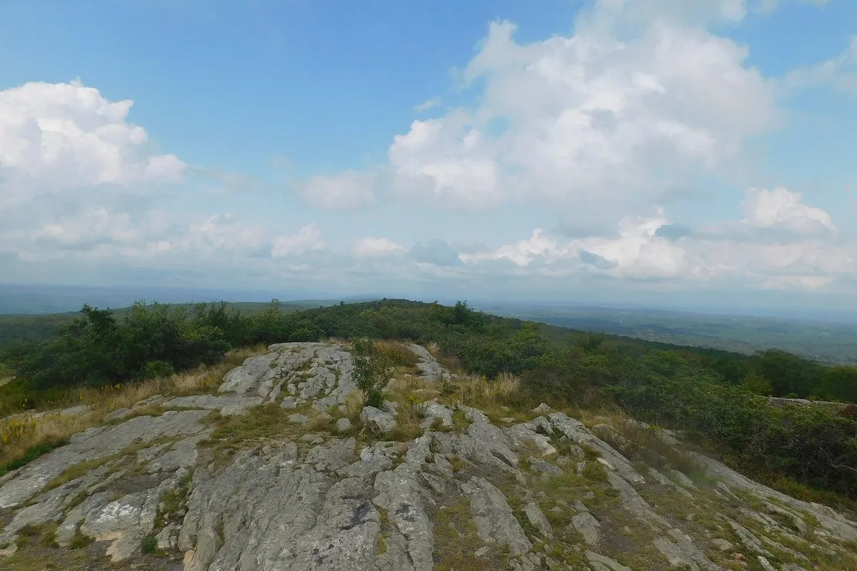 Scenic view at High Point State Park, New Jersey, showing the High Point Monument rising above forested ridgeline with expansive valley views