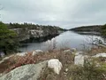 Scenic view of the turquoise sky lake and rocky Shawangunk Ridge cliffs at Minnewaska State Park Preserve, New York