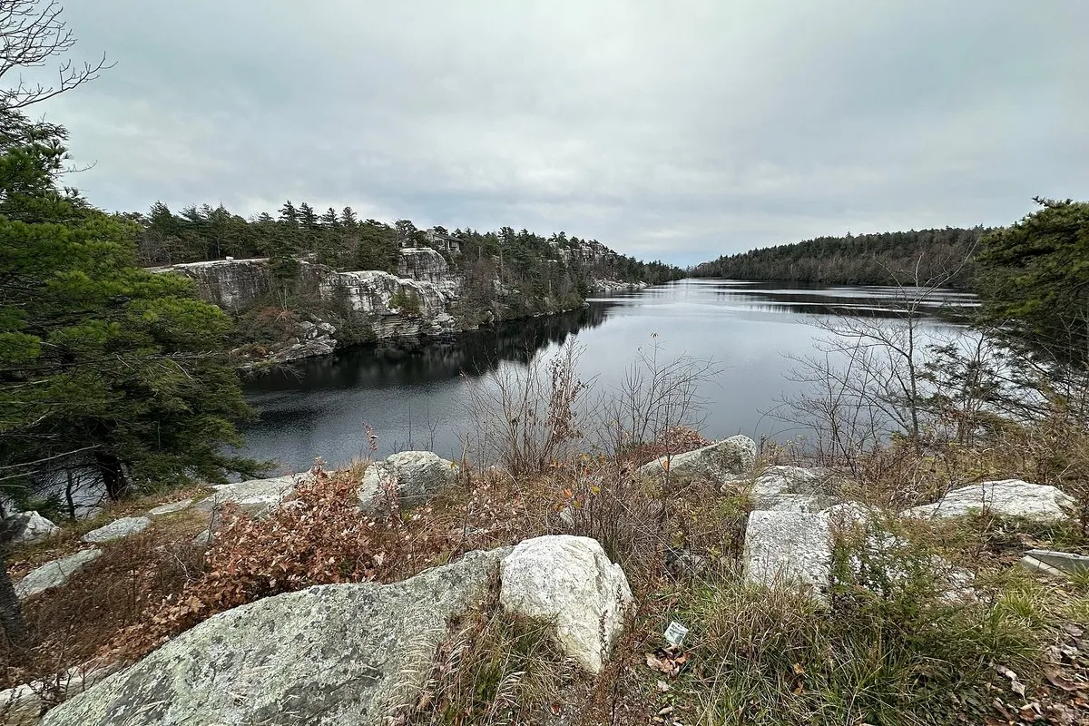 Scenic view of the turquoise sky lake and rocky Shawangunk Ridge cliffs at Minnewaska State Park Preserve, New York