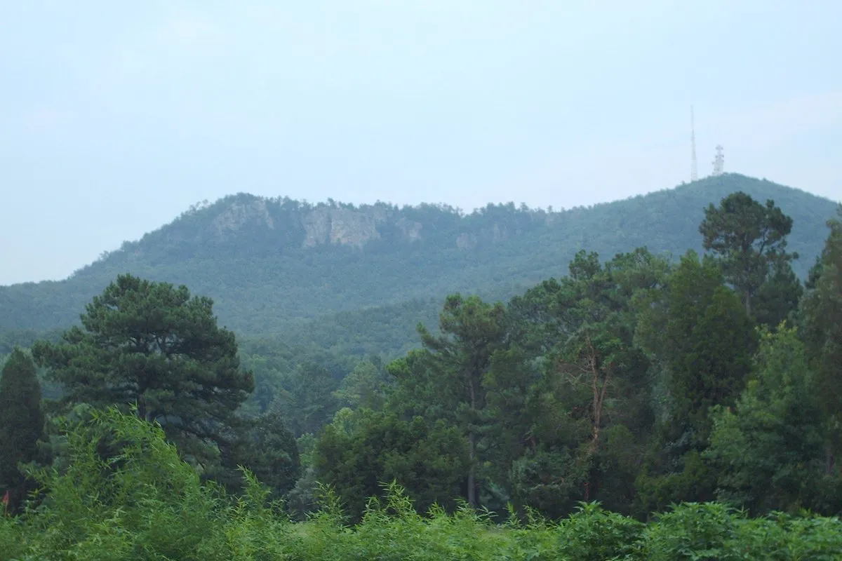 Scenic view from the rocky summit of Crowders Mountain looking out over forested hills in North Carolina