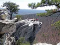 Rocky summit outcrop with sweeping forested valley views at Hanging Rock State Park, North Carolina