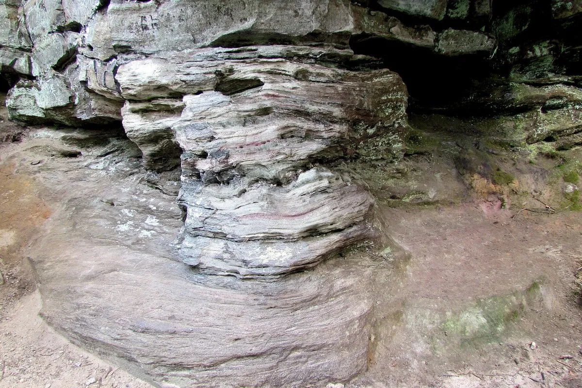Aerial view of Pilot Mountain's rounded quartzite Big Pinnacle rising above forested ridgelines in North Carolina