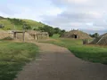 Reconstructed earthlodge structures and open prairie landscape at Fort Abraham Lincoln State Park, North Dakota
