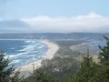 Scenic view of the forested Cape Lookout headland jutting into the Pacific Ocean, Oregon