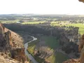 Towering volcanic rock spires reflected in the Crooked River at Smith Rock State Park, Oregon