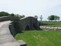 Scenic coastal view of manicured lawns and Narragansett Bay shoreline at Colt State Park, Rhode Island