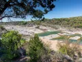 Scenic view of the tiered limestone falls and Pedernales River flowing through Texas Hill Country at Pedernales Falls State Park