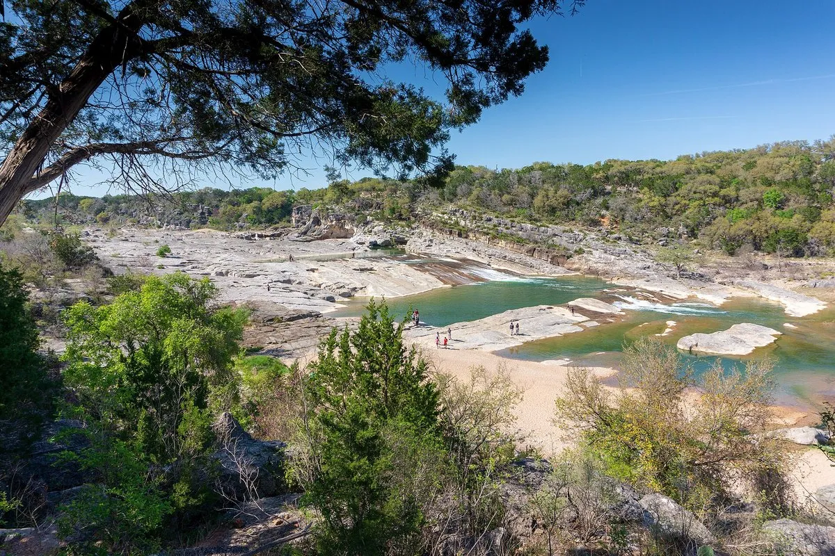 Scenic view of the tiered limestone falls and Pedernales River flowing through Texas Hill Country at Pedernales Falls State Park
