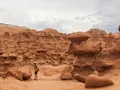 Hundreds of eroded sandstone hoodoo formations filling the valley floor at Goblin Valley State Park, Utah, under a wide open sky