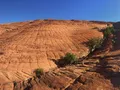 Sweeping view of red sandstone cliffs and lava rock formations at Snow Canyon State Park, Utah