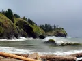 Scenic view at Cape Disappointment, Washington, with rugged Pacific coastline and forested headland