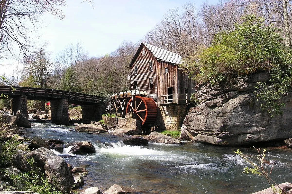 Scenic view of the historic Glade Creek Grist Mill surrounded by autumn foliage at Babcock State Park, West Virginia