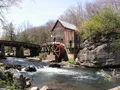 Scenic view of the historic Glade Creek Grist Mill surrounded by autumn foliage at Babcock State Park, West Virginia