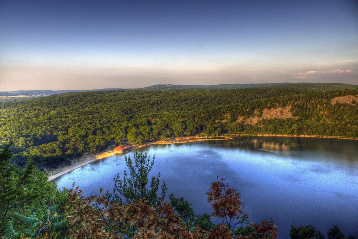 Scenic view of Devil's Lake surrounded by towering quartzite bluffs and forested slopes, Wisconsin