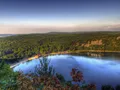 Scenic view of Devil's Lake surrounded by towering quartzite bluffs and forested slopes, Wisconsin
