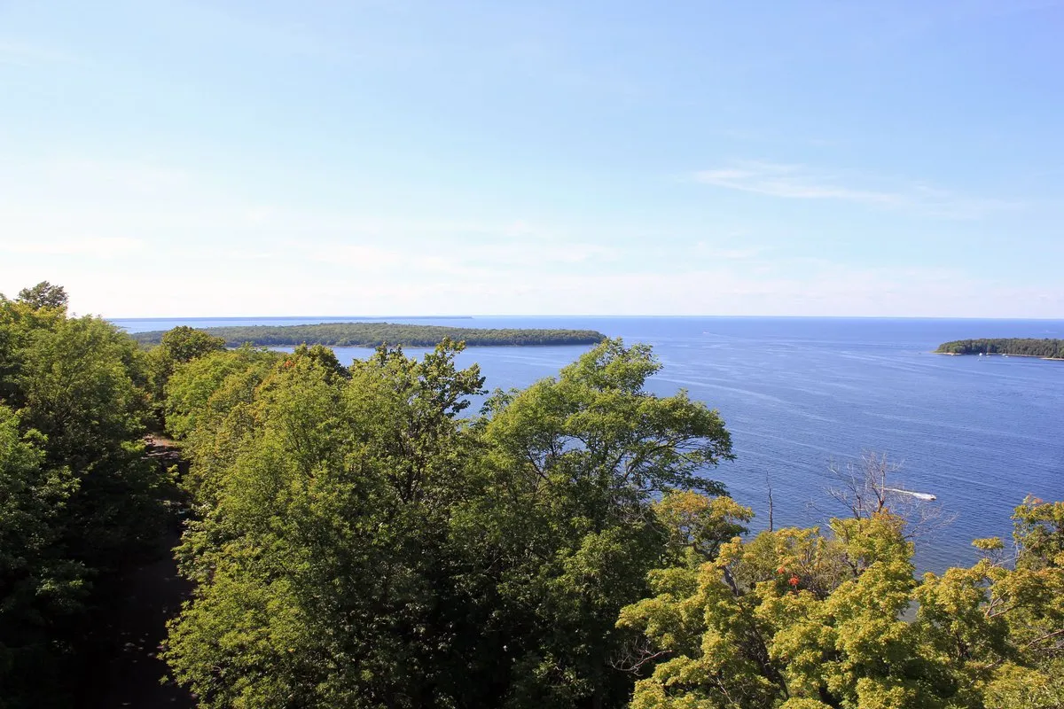 Scenic view of Peninsula State Park, Wisconsin, showing forested bluffs along the Lake Michigan shoreline