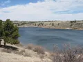 Rocky granite formations and reservoir waters at Curt Gowdy State Park, Wyoming
