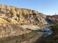 Colorful mineral terraces and steaming hot spring pools at Hot Springs State Park, Wyoming